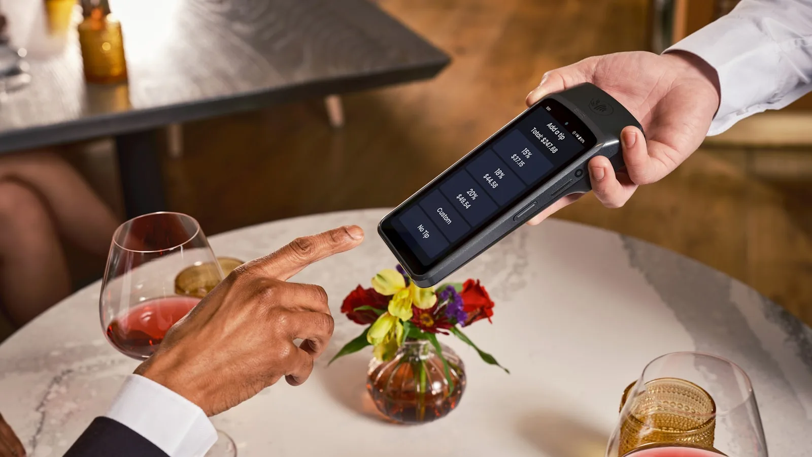 Settling the bill at the table in a restaurant