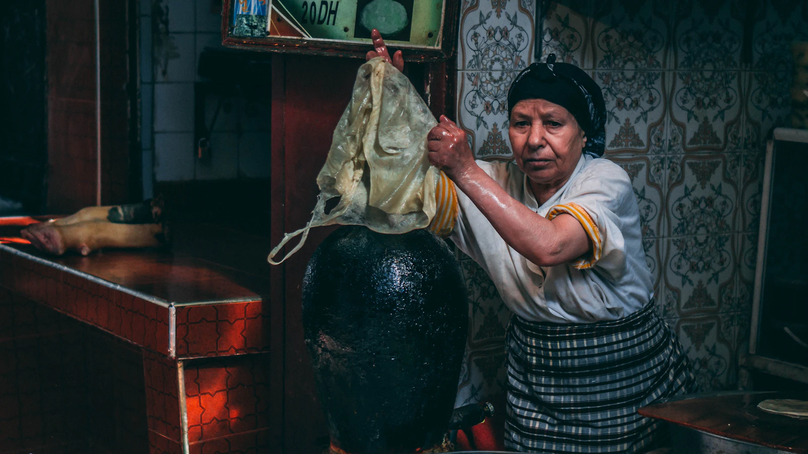 A cook prepares dough in a Moroccan kitchen