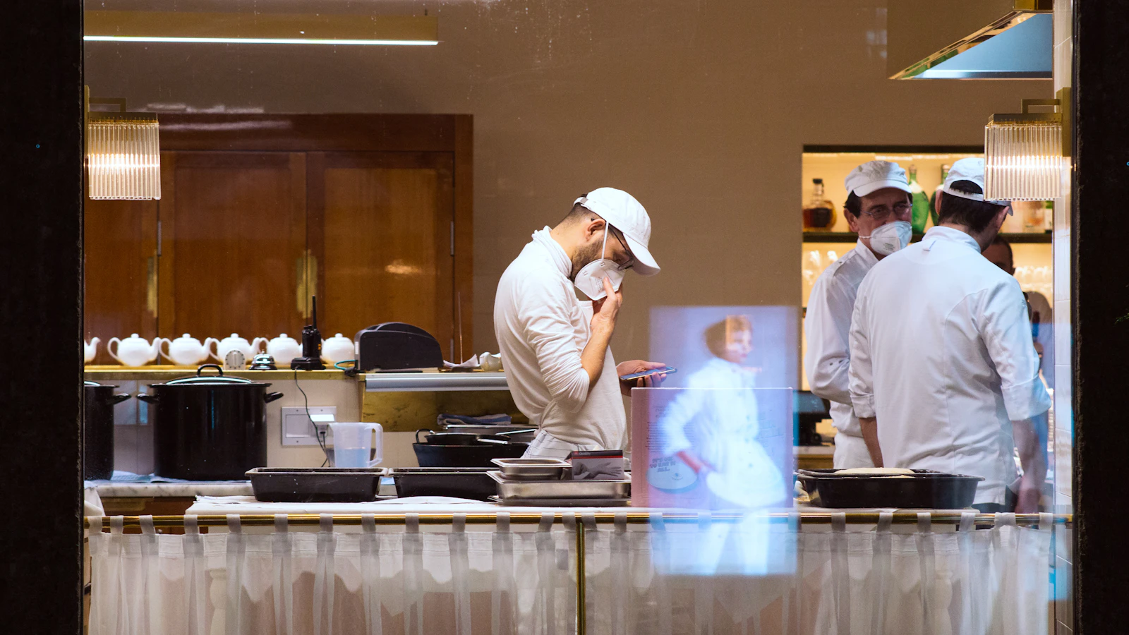 Kitchen team preparing orders during restaurant service