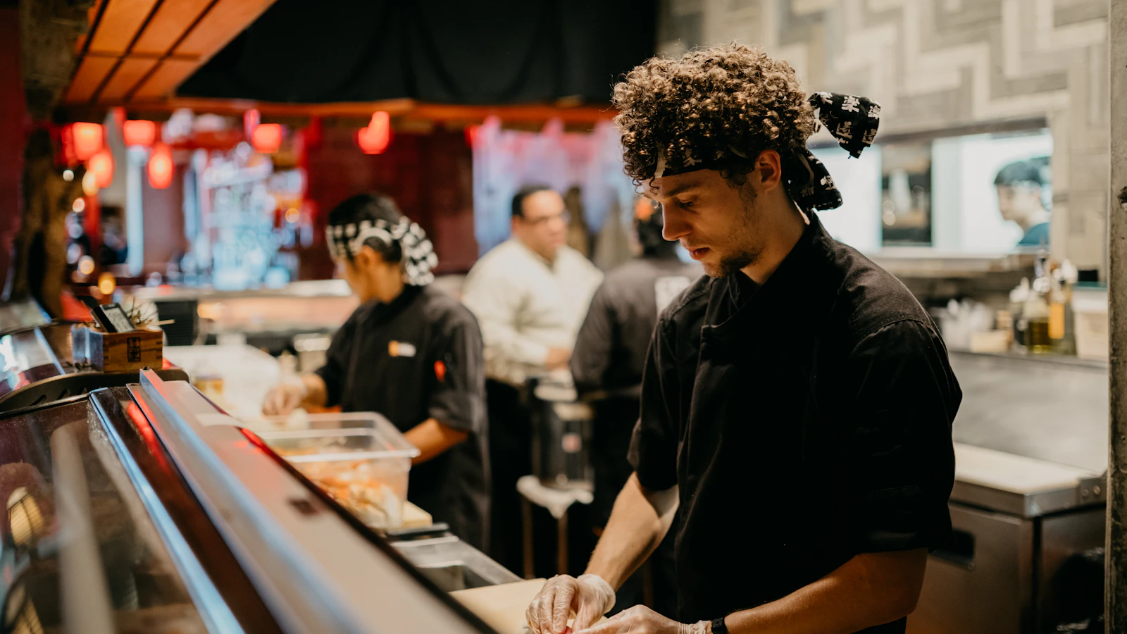 Kitchen team preparing restaurant orders during service